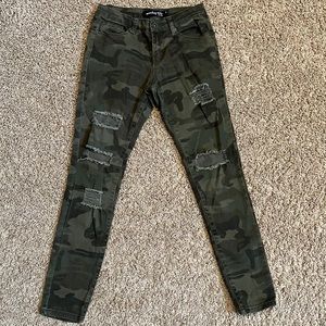 Distressed and ripped camouflage skinny leg pants size 1